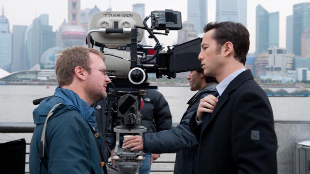 Rian Johnson with Joseph Gordon Levitt on set.