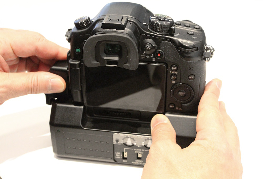 Rear view of GH4 joined to DMW-YAGH, with audio controls at bottom.