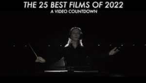 Cate Blanchett conducts an orchestra as Lydia Tár, a banner above her reads "The 25 Best Films of 2022: A Video Countdown."