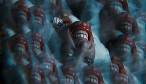 A kaleidoscopic image of a girl's face, her teeth are bared and her mouth is covered in blood.