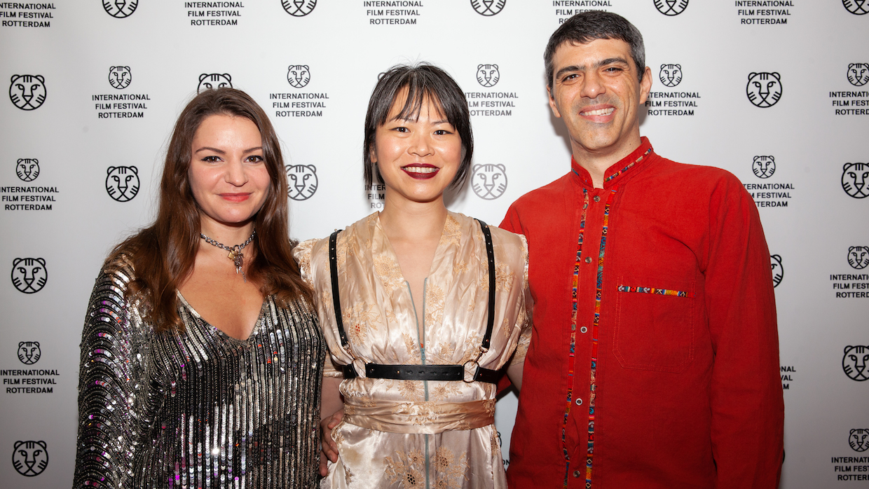 Samara Bliss, Winnie Cheung and Dan Rosato pose on the red carpet at IFFR 2023.