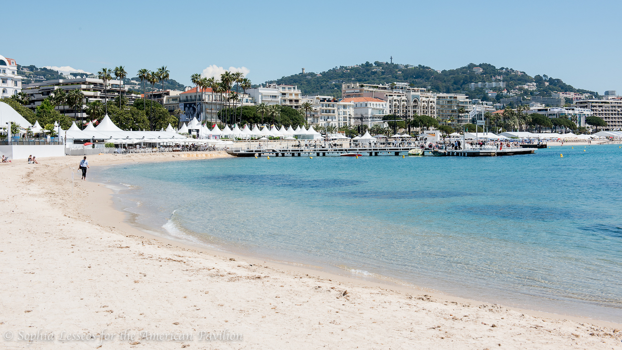 The crescent-shaped coastline of a sandy beach in Cannes, France.