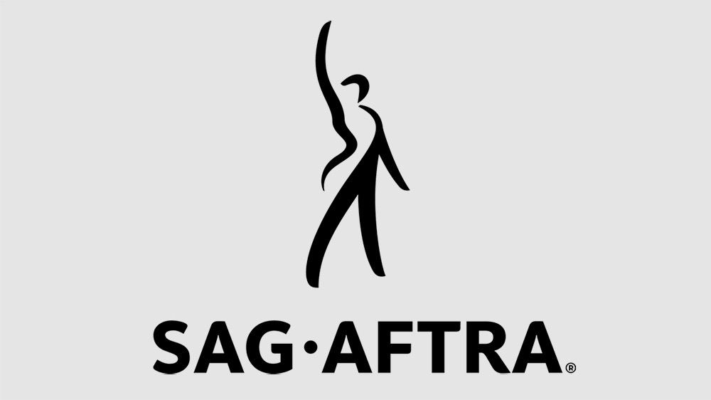 A logo containing the word "SAG-AFTRA" and a stylized drawing of a performer.