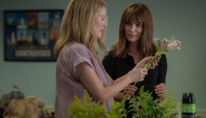 Gracie Atherton-Yoo (Julianne Moore) demonstrates flower arranging for Elizabeth Barry (Natalie Portman) in a scene from Todd Haynes's May December.