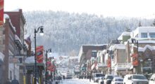 Park City's Main Street covered with a thick layer of snow on a bright January day.