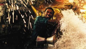 A man struggles to close a door on a flooding submarine.