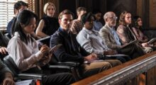 A jury sits in a courtroom.