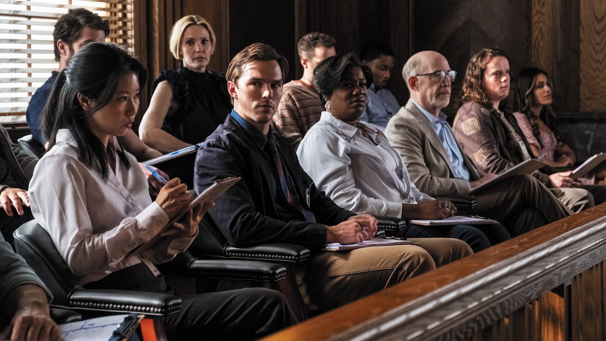 A jury sits in a courtroom.