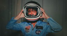 Sally Ride wearing an astronaut helmet.