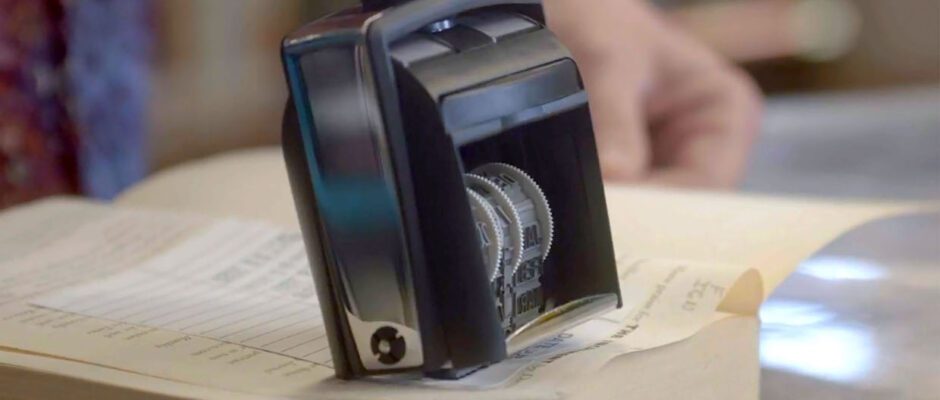 A black stamp marks the return date on a library book.