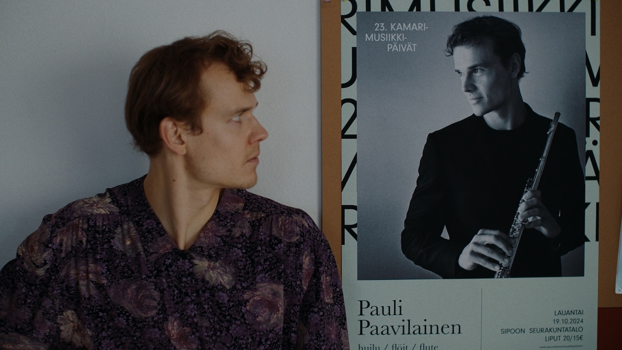 light | Filmmaker Magazine A flautist stares at a poster of himself.